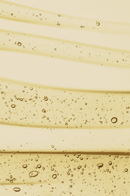Product with vitamin C spread out on a yellow background